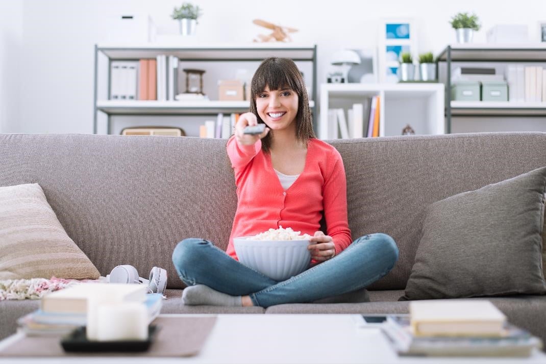 Woman watching TV broadcast