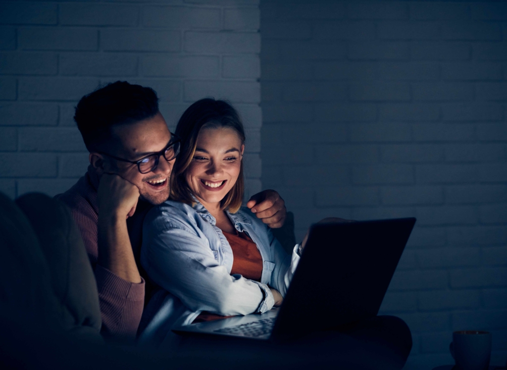 a couple watching tv with DTH service