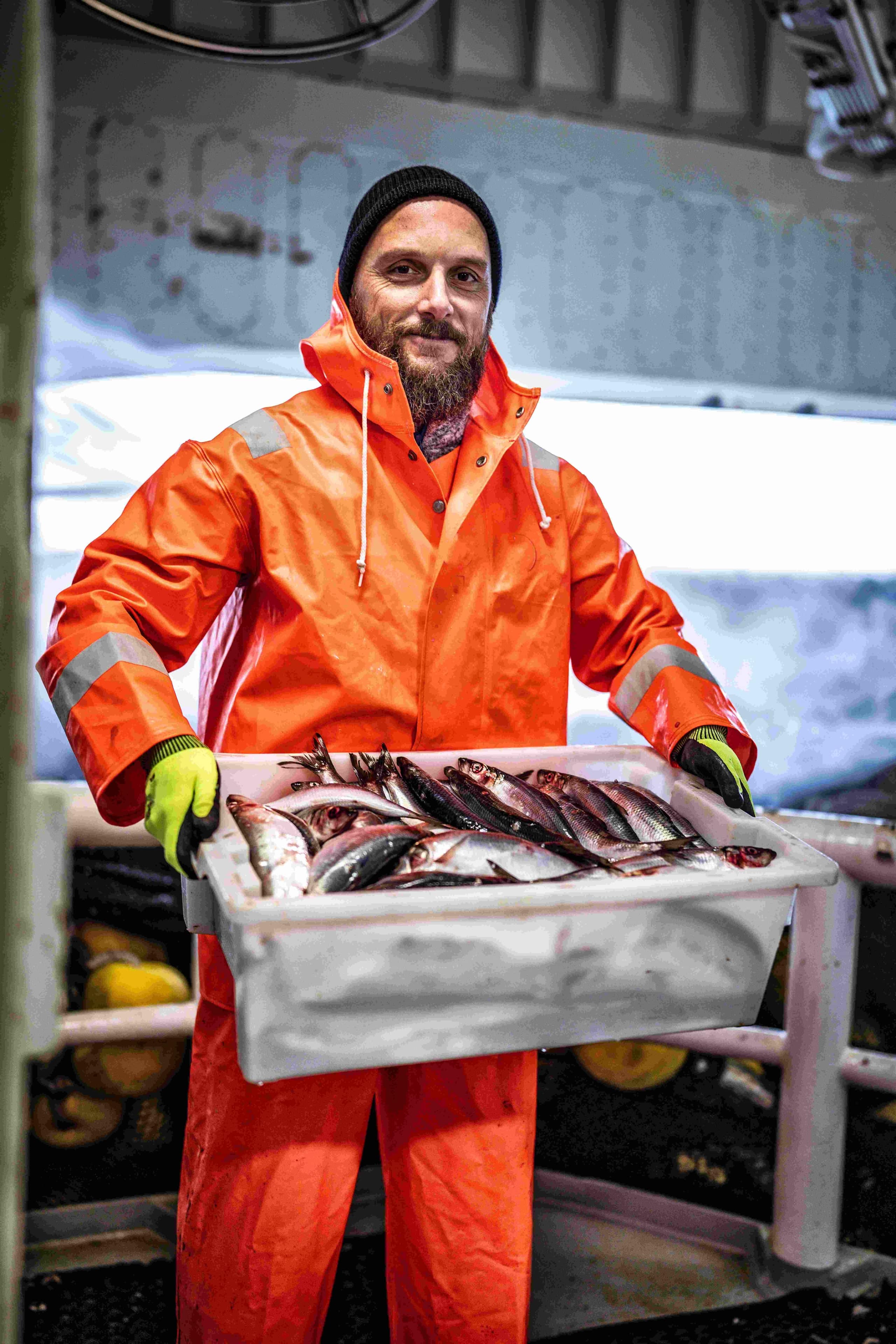 Connectivity for fishing vessels improves operations. Fisherman onboard a trawler.