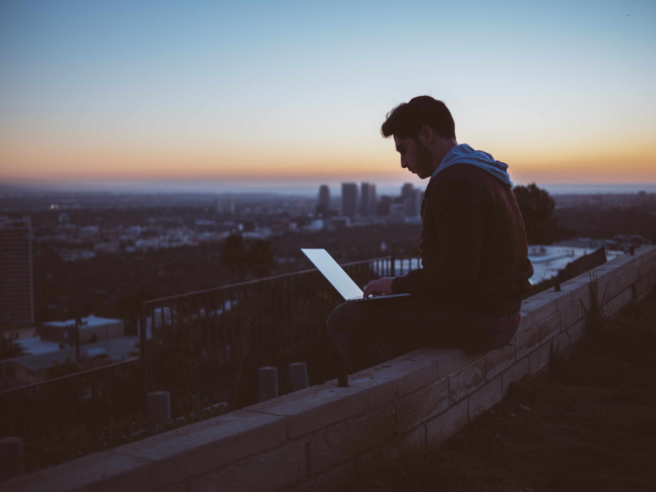 Young man browsing internet on pc