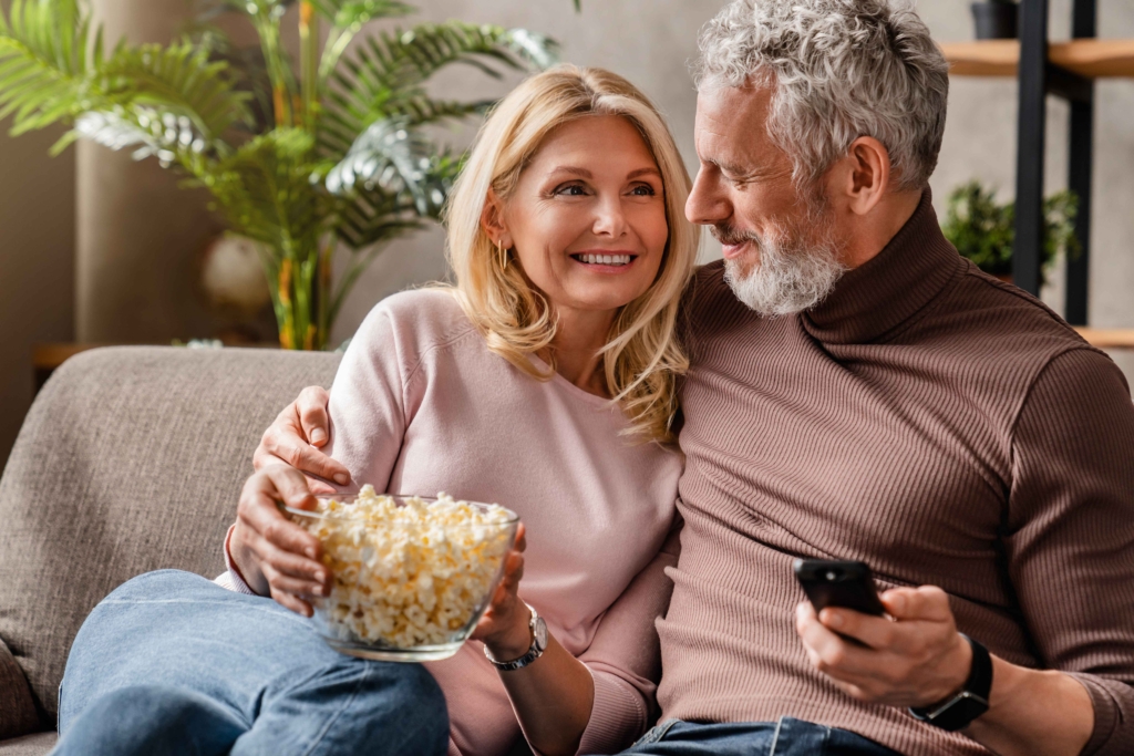 a couple watching tv broadcasting