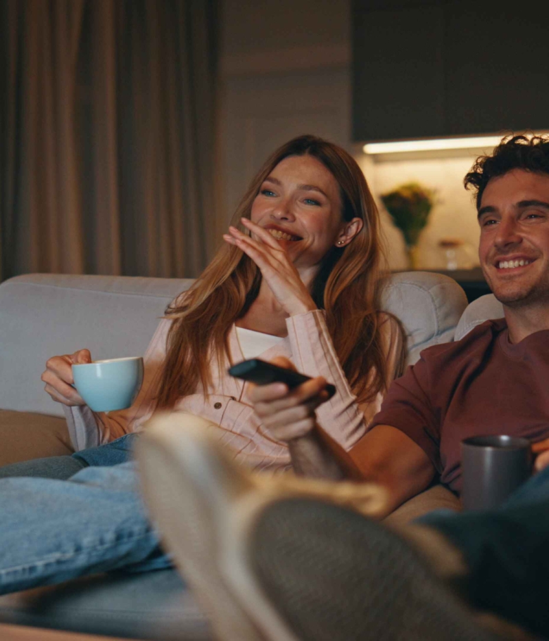 a couple watching tv in a European video neighbourhood